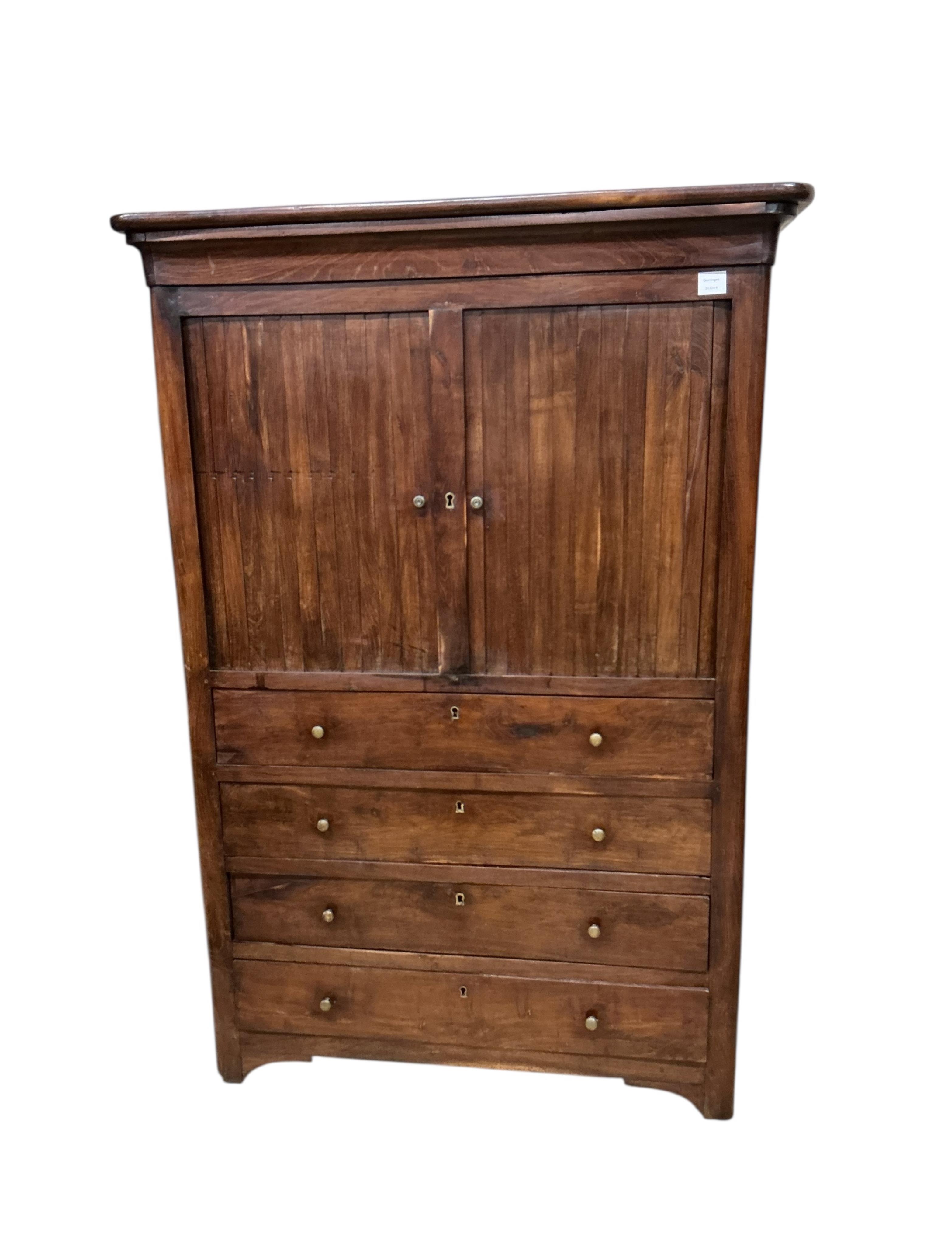A cabinet, the upper section with twin tambour doors, enclosing a shelved interior, above the lower section with four long drawers, width 108cm, depth 45cm, height 158cm